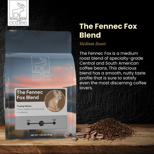 The Fennec Fox medium roast coffee blend bag with coffee beans and grounds on wooden surface