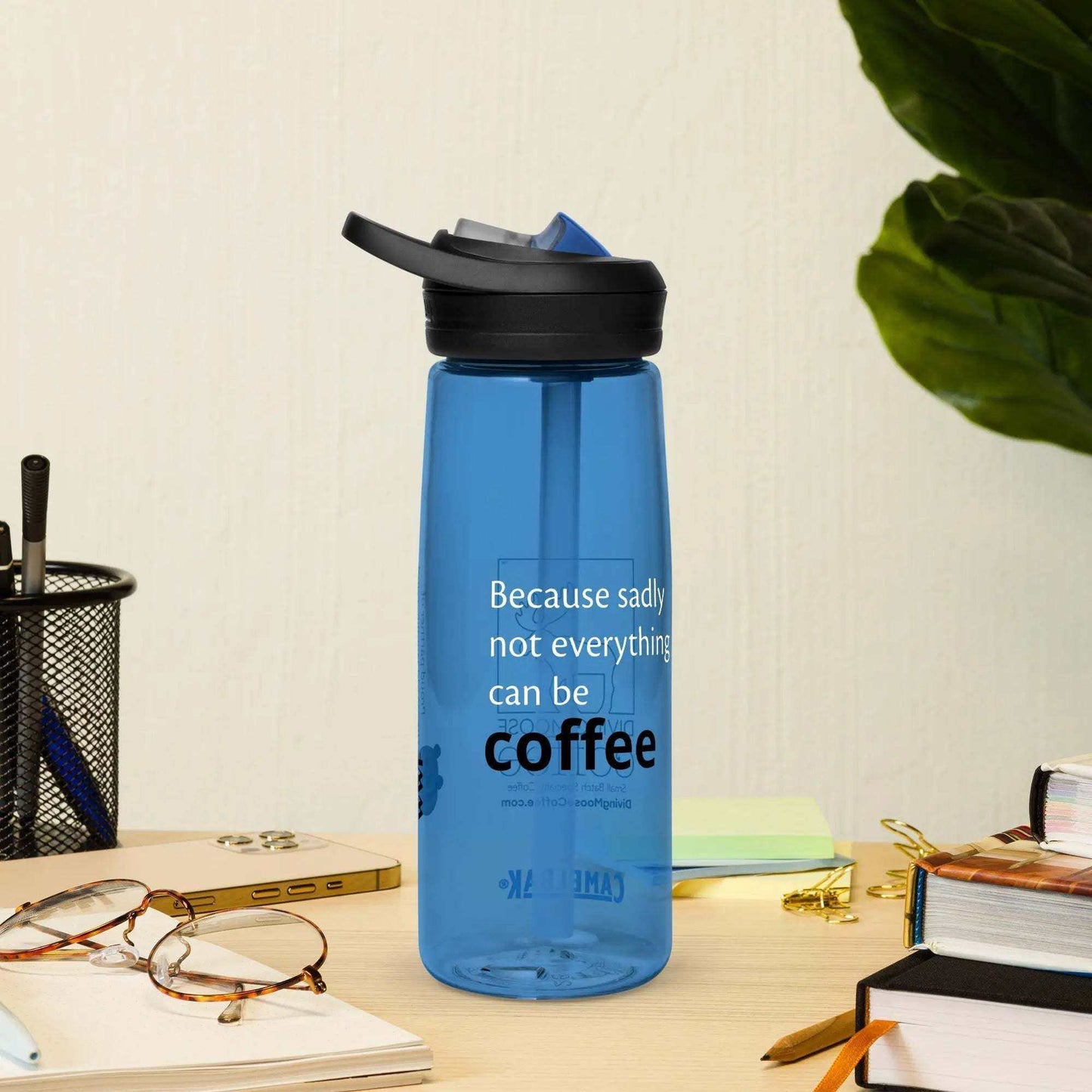 Blue CamelBak Eddy+ water bottle with spill-proof lid and carry handle on wooden desk