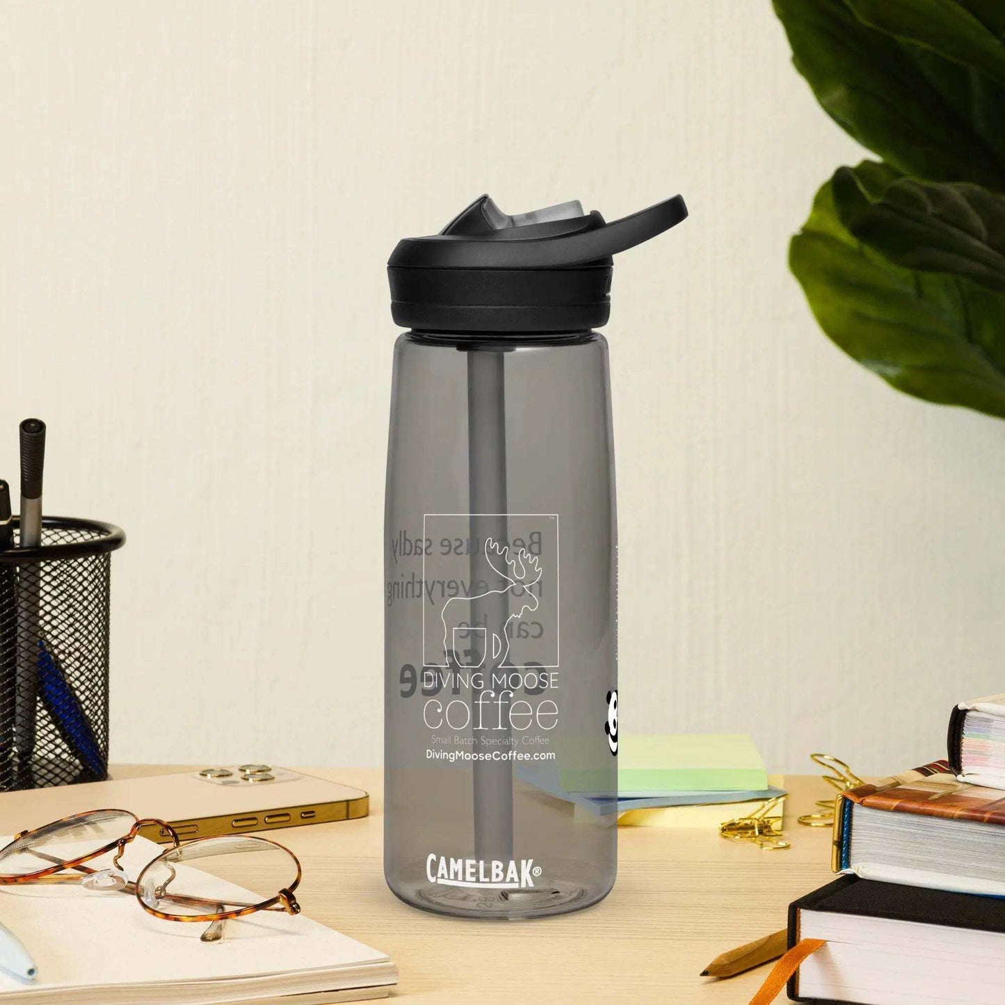 CamelBak Eddy+ water bottle made from 50% recycled plastic with spill-proof lid and bite valve on desk